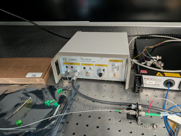 Nano-second pulsed laser on an optical table.